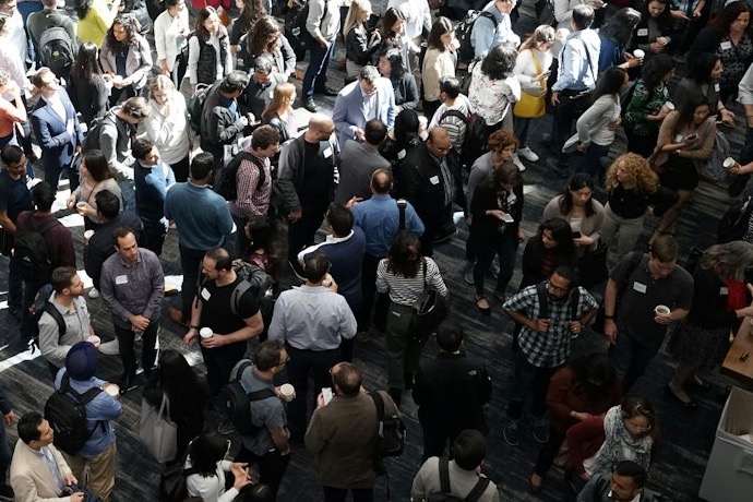 Attendees mingling in a busy exhibition hall